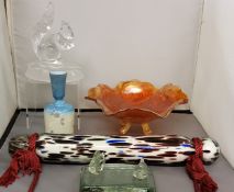 A Nailsea glass rolling pin, mottled in black and blue and white ground, 35cm long;   a Carnival