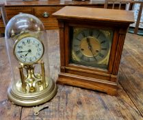 A  German oak  mantel clock, silvered dial, Roman numerals, twin winding holes, 29cm  high, c.1890;