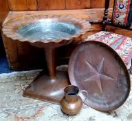 An unusual Arts & Crafts period hammered copper pedestal fountain/urn, flared bowl with undulating