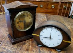 An early 20th century mahogany mantel clock, the 14cm brass dial with Arabic numerals, twin