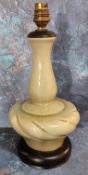 A Korean celedon side light, ebonised base, 34cm high
