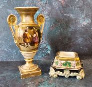 A French porcelain two handled pedestal ovoid vase, in the Empire taste, decorated with medieval