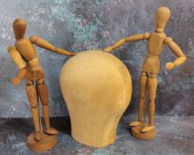 A pair of artist's jointed mannequins approx. 30cms high; a turned solid wood head (3)