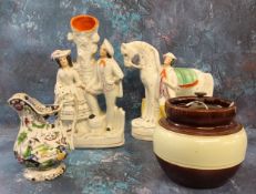A Staffordshire flatback model, Horse and Boy, c,1880;  a similar spill vase, Courting Couple, c.