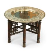 A MOORISH CIRCULAR BRASS TRAY-TOP TABLE, CIRCA 1900