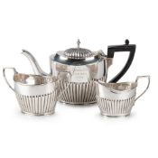 A LATE VICTORIAN SILVER THREE-PIECE BACHELOR'S TEA SERVICE