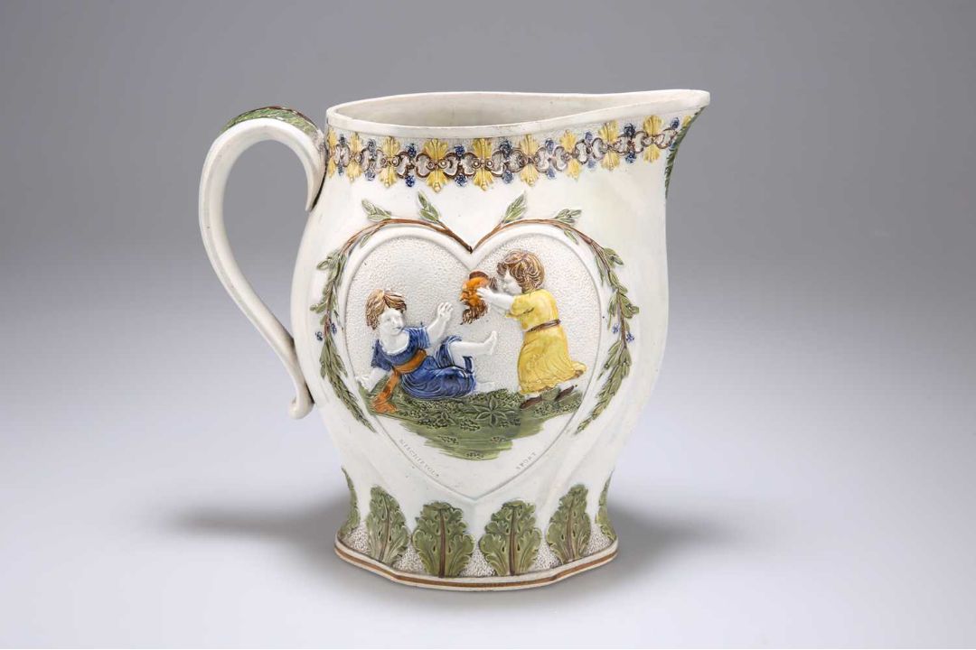 A PEARLWARE JUG MOULDED WITH SCENES REPRESENTING 'MISCHIEVOUS SPORT' AND 'SPORTING INNOCENCE' - Image 2 of 3