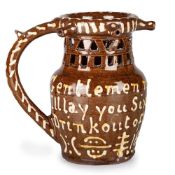A NORTH COUNTRY SLIPWARE PUZZLE JUG