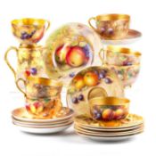 A ROYAL WORCESTER FRUIT PAINTED PARTIAL TEA SERVICE