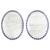 A PAIR OF IRISH OVAL WALL MIRRORS