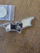 batman and swiss of America coin
