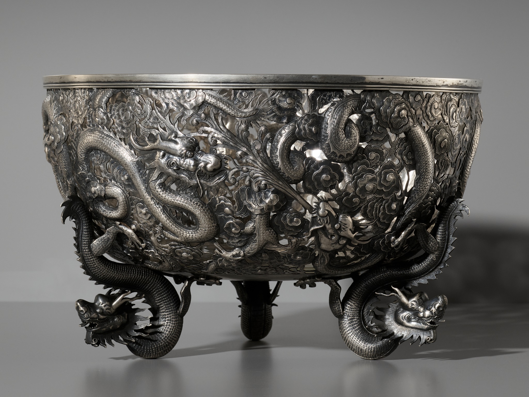 A LARGE SILVER 'DRAGON' RETICULATED PUNCH BOWL, MARKS OF SUI CHANG AND WANG HING