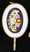Pocket watch key, oval, multicolored floral enamel center in mosaic style surrounded by light blue e