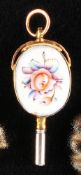 Gold enamel pocket watch key, both sides with oval enamel medallions with colorful floral decor, 