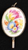 Pocket watch key, oval, porcelain, colorfully painted with floral decoration, in silver setting
