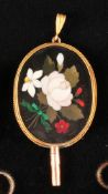 Pocket watch key, oval 14 ct. gold setting depicting a bouquet of flowers