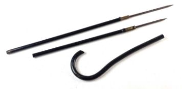 An early 20th-century metal sword cane, pulling apart to three pieces to reveal two separate