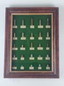 Framed display of inert ammunition
