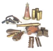 Militaria including powder flasks, trench art, signal cannon etc
