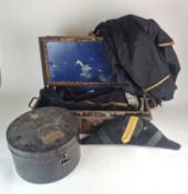 A small rectangular tin trunk containing a Naval Officer's or Court Uniform full dress tail coat,