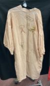 Fashion: Pink silk kimono embroidered with dragons and clouds. White cotton pantaloons,