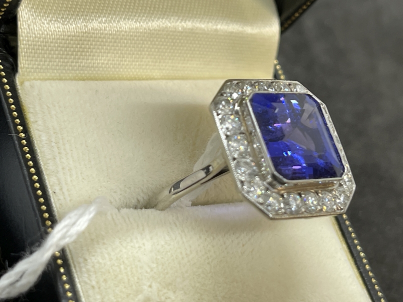 Jewellery: White metal ring in the form of a twenty one stone 18.3mm square cluster with cut
