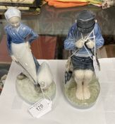 Royal Copenhagen: Boy whittling seated on a rock No. 905, plus goose girl No. 067/58.