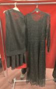 1920s/30s Fashion: Black lace floor length dinner dress, long sleeves, V neck, small bow trim to