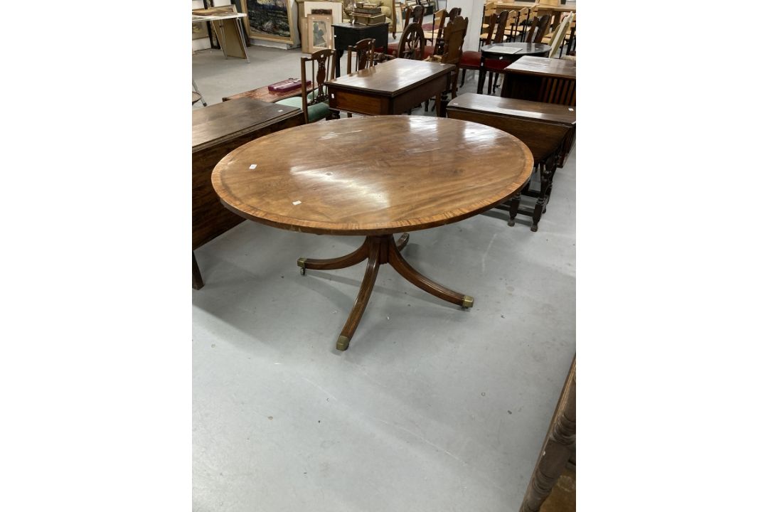 Regency mahogany oval breakfast table on single column and four splayed supports. 52ins. - Image 1 of 3