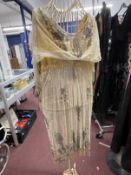 1920s/30s Fashion: Flapper dress, lemon colour bodice, tulle skirt with bead fringe, split to