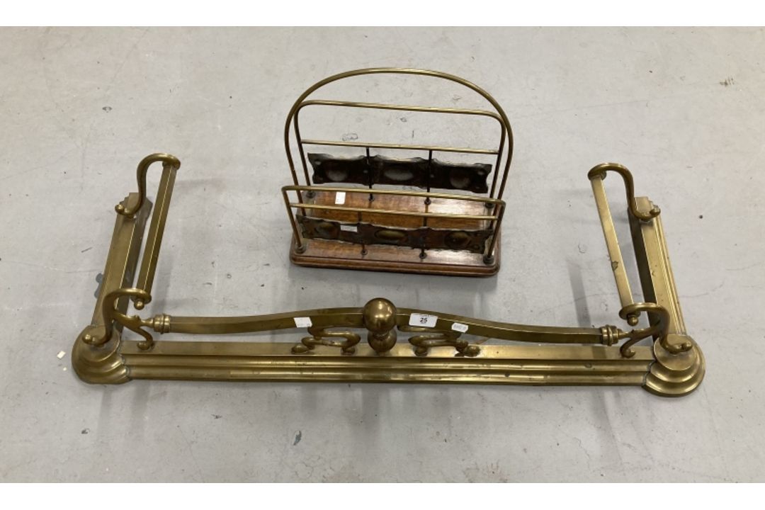 Art nouveau brass fender and an early 20th cent. brass & oak magazine rack.