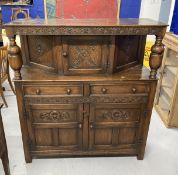 20th cent. Oak Jacobean style court cupboard the top with carved frieze and two turned columns, a