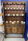 20th cent. Oak dresser, the rack with shaped frieze, two shelves, the base with two short drawers
