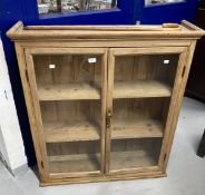 Late 19th cent. pine glazed door cupboard moulded cornice above 2 glazed doors & 2 fitted shelves.