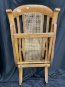 Early 20th century folding steamer chair with rattan seat and back.