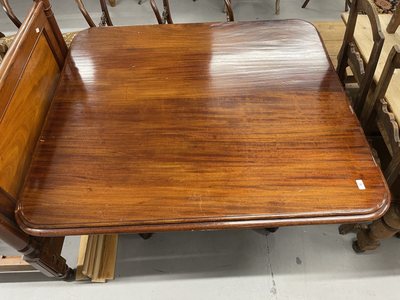 Early 20th cent. Mahogany rectangular tilt top dining table on turned central support with tripod