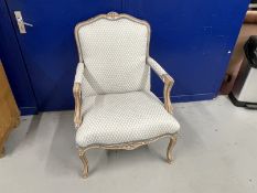 20th cent. French style open arm chair with blue upholstery and piping over a limed finish.