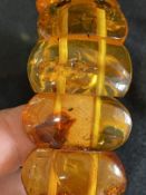 Jewellery: Bangle consisting of thirteen 25.5mm x 20mm amber links.