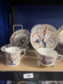 Pair of Derby teacups and saucers and one coffee can, painted with a Japanese Imari pattern c1820.