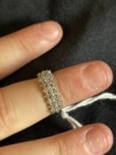 Jewellery: White metal three row half hoop ring set with twenty-eight brilliant cut diamonds,