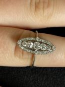 Jewellery: White metal Edwardian ring in the form of a Marquise shaped cluster set with thirty