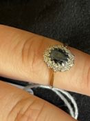 Hallmarked Jewellery: 18ct gold oval cluster centre set with an oval cut sapphire, estimated