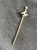 Jewellery: Yellow metal stock pin with the initial H attached set with thirteen rose cut diamonds