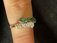 Jewellery: Yellow and white metal double row half hoop, one row set with four diamonds; one pear