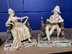 Ceramics: Royal Dux figure pairing of a lady and gentleman sitting on two benches. 8½ins. x 7ins. (