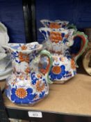 Mason's Ironstone: Imari dragon handled graduated set of jugs. 9ins, 8ins, 6½ins. (3)