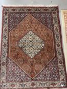 Rugs & Carpets: 20th cent. Middle Eastern carpet predominantly in red refreshed with ivory. 65ins. x