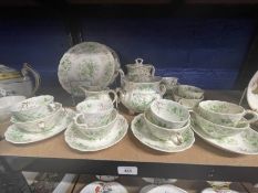 19th cent. Rockingham tea/coffee service with green flowers and gilt decoration comprising teapot,