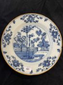 18th cent. Dutch Delft charger, blue central panel garden and trees, outer border fine floral