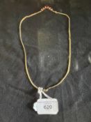 Jewellery: Yellow metal S link chain with a V shaped drop set with seven graduated marquise cut